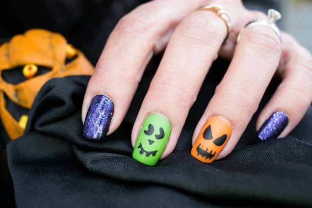 Fall Halloween nail color combinations in brown burgundy orange cream and black