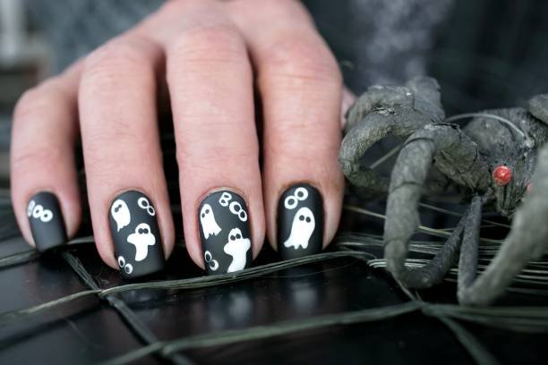 Polished elegant fall Halloween nail art with minimal details